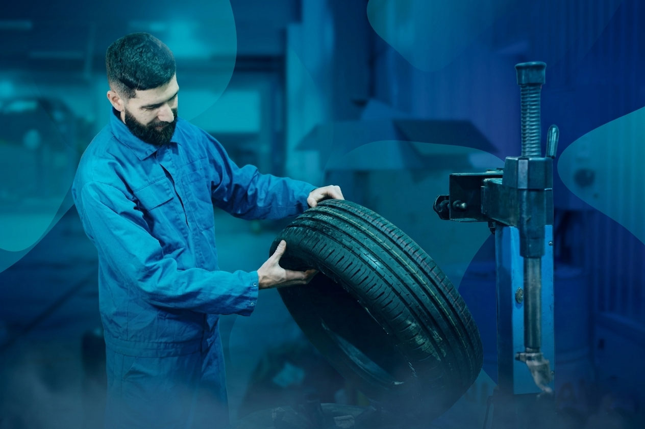 man holding tyre